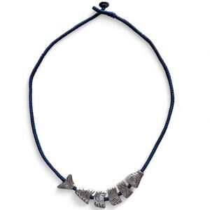 Segmented worry fish corded necklace